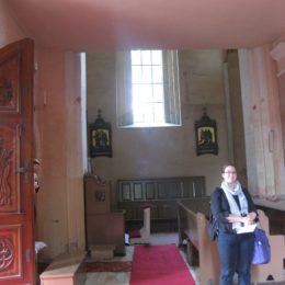 Beck standing in Lekno church of her greatgreatgreat gramma Francisca Rozmarynowska Lasecki